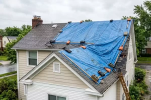 Emergency roof repair after storm damage to a residential home
