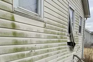 a house with damaged siding